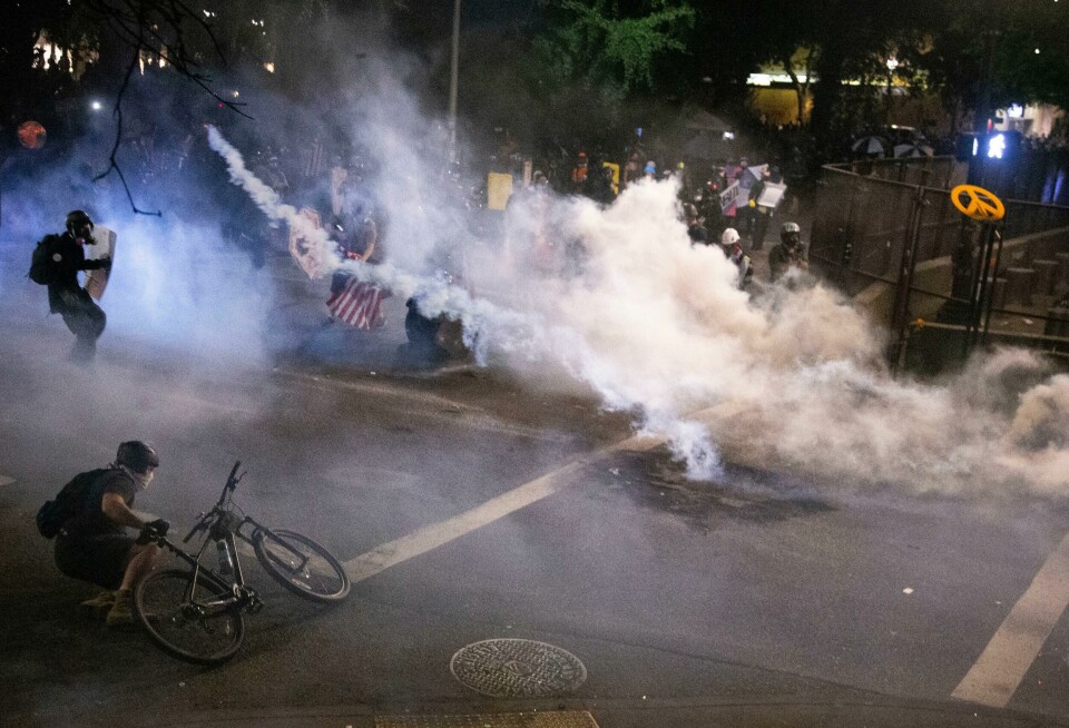 Federal officers use chemical irritants and projectiles to disperse Black Lives Matter protesters early late Thursday, July 23, 2020, in Portland, Ore. Since federal officers arrived in downtown Portland in early July, violent protests have largely been limited to a two block radius from the courthouse. (Beth Nakamura /The Oregonian via AP) Federal officers use chemical irritants and projectiles to disperse Black Lives Matter protesters early late Thursday, July 23, 2020, in Portland, Ore. Since federal officers arrived in downtown Portland in early July, violent protests have largely been limited to a two block radius from the courthouse. (Beth Nakamura /The Oregonian via AP)