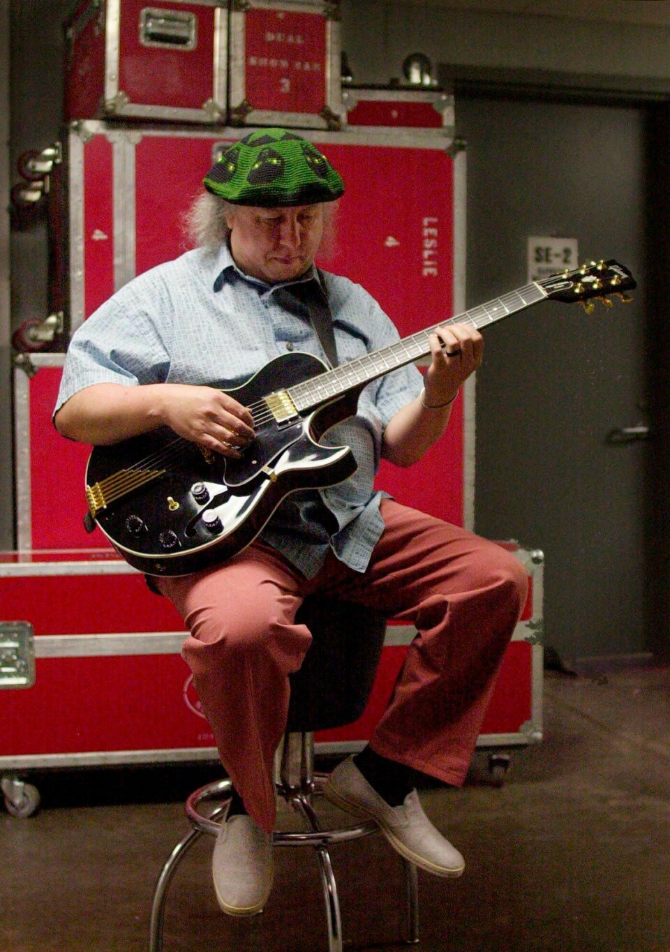 FILE - In this file photo dated Saturday, April 7, 2001, British rock and blues guitarist Peter Green, a founding member of Fleetwood Mac, warms up backstage before performing with his own band, Peter Green's Splinter Group, at B.B. King Blues Club & Grill, in New York. Lawyers representing the family of Peter Green, say in a statement Saturday July 25, 2020, that he has died, aged 73. (AP Photo/Mark Lennihan, FILE)