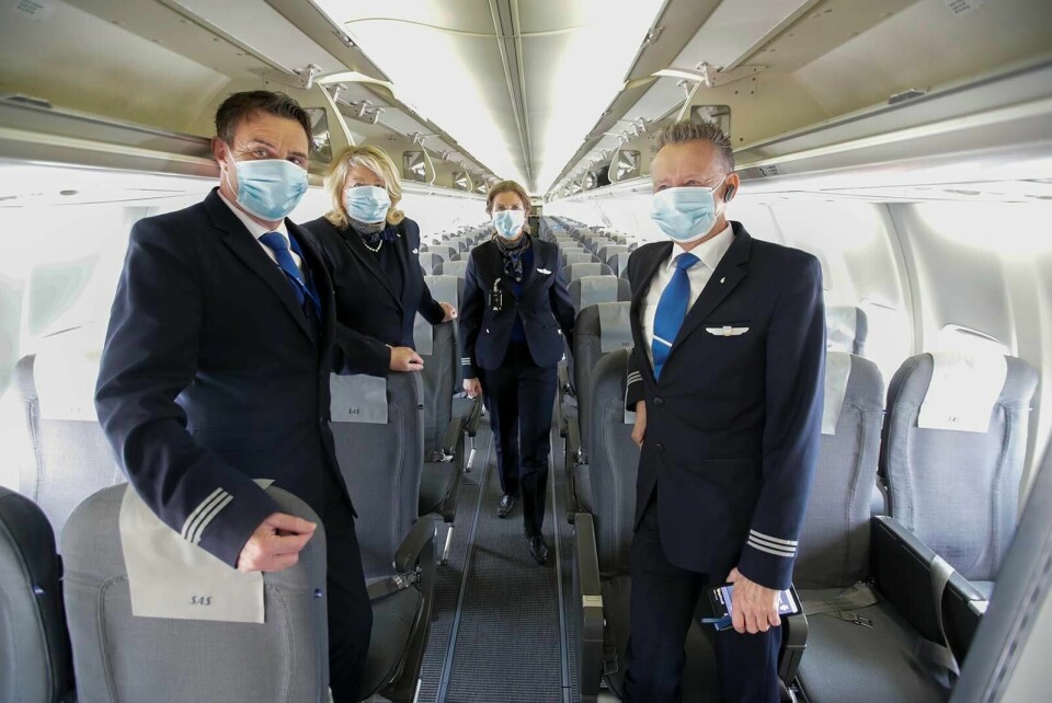Munnbind har vist seg å fungere fint på fly. Dagsavisen støtter derfor en tydelig anbefaling fra våre myndigheter om dette. Foto: Vidar Ruud/NTB scanpix