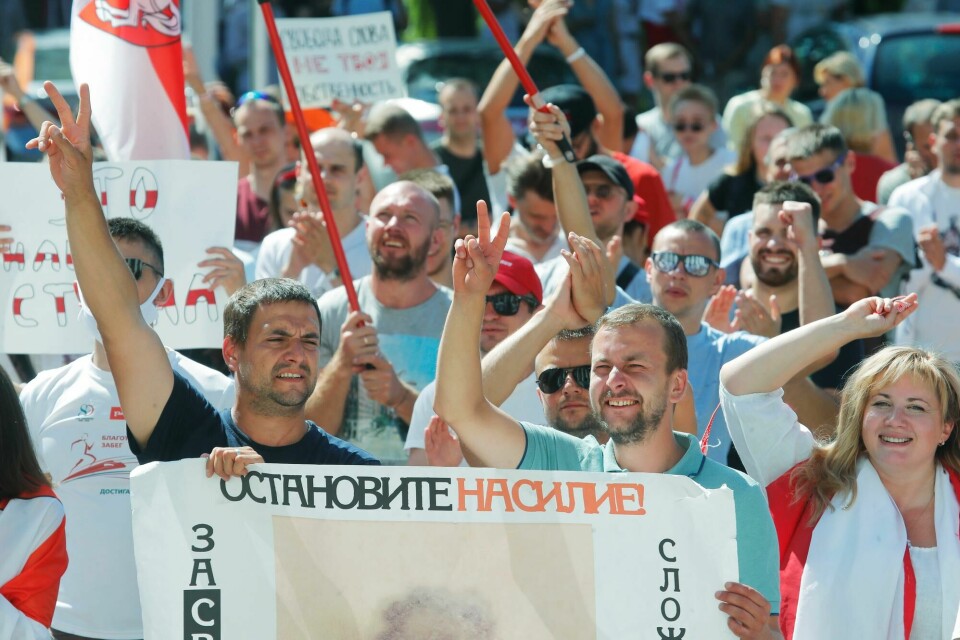 People hold a banner reading 'Stop violence!' during a rally near the Belarus Television headquarters in Minsk, Belarus, Monday, Aug. 17, 2020. Thousands of factory workers are taking to the streets of Minsk demanding the resignation of authoritarian President Alexander Lukashenko, in the ninth straight day of protests against an election that extended his long rule over the country. (AP Photo/Dmitri Lovetsky) People hold a banner reading 'Stop violence!' during a rally near the Belarus Television headquarters in Minsk, Belarus, Monday, Aug. 17, 2020. Thousands of factory workers are taking to the streets of Minsk demanding the resignation of authoritarian President Alexander Lukashenko, in the ninth straight day of protests against an election that extended his long rule over the country. (AP Photo/Dmitri Lovetsky)
