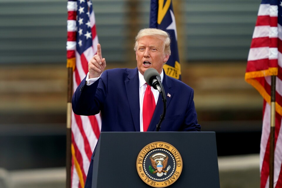 With the USS Battleship North Carolina in the background, President Donald Trump speaks on Wednesday, Sept. 2, 2020, in Wilmington, N.C. (AP Photo/Gerry Broome) With the USS Battleship North Carolina in the background, President Donald Trump speaks on Wednesday, Sept. 2, 2020, in Wilmington, N.C. (AP Photo/Gerry Broome)