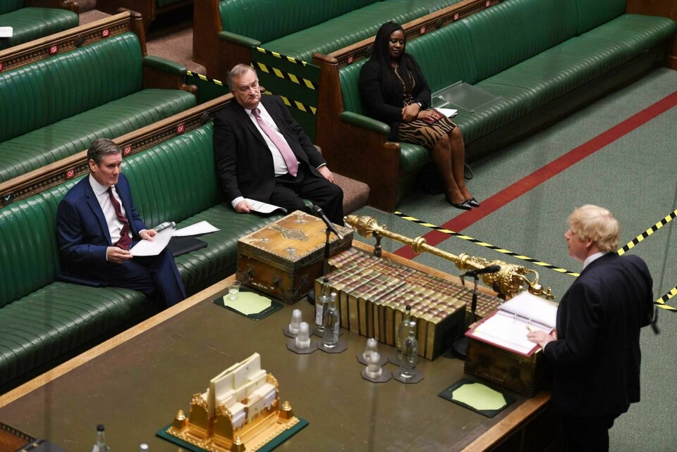 A handout photograph released by the UK Parliament shows shows Britain's main opposition Labour Party leader Keir Starmer (L) listening as Britain's Prime Minister Boris Johnson speaks at Prime Minister's Question time (PMQs) in the House of Commons in London on May 6, 2020, as parliament continues with social distancing measures in place, and some MPs taking part remotely by videolink, due to the novel coronavirus COVID-19 pandemic. - British Prime Minister Boris Johnson said Wednesday he could begin to ease a nationwide coronavirus lockdown next week, but warned he would do nothing that would risk a new surge of cases. He was speaking the day after Britain overtook Italy to become the worst-hit country in Europe, with more than 32,000 deaths related to COVID-19 -- behind only the United States in the global rankings. (Photo by JESSICA TAYLOR / various sources / AFP) / RESTRICTED TO EDITORIAL USE - NO USE FOR ENTERTAINMENT, SATIRICAL, ADVERTISING PURPOSES - MANDATORY CREDIT ' AFP PHOTO / Jessica Taylor /UK Parliament' A handout photograph released by the UK Parliament shows shows Britain's main opposition Labour Party leader Keir Starmer (L) listening as Britain's Prime Minister Boris Johnson speaks at Prime Minister's Question time (PMQs) in the House of Commons in London on May 6, 2020, as parliament continues with social distancing measures in place, and some MPs taking part remotely by videolink, due to the novel coronavirus COVID-19 pandemic. - British Prime Minister Boris Johnson said Wednesday he could begin to ease a nationwide coronavirus lockdown next week, but warned he would do nothing that would risk a new surge of cases. He was speaking the day after Britain overtook Italy to become the worst-hit country in Europe, with more than 32,000 deaths related to COVID-19 -- behind only the United States in the global rankings. (Photo by JESSICA TAYLOR / various sources / AFP) / RESTRICTED TO EDITORIAL USE - NO USE FOR ENTERTAINMENT, SATIRICAL, ADVERTISING PURPOSES - MANDATORY CREDIT ' AFP PHOTO / Jessica Taylor /UK Parliament'