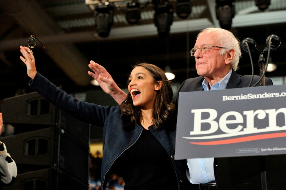(FILES) In this file photo taken on February 10, 2020 Congresswoman Alexandria Ocasio-Cortez and Presidential Candidate Vermont Senator Bernie Sanders wave to his supporters at rally at the University of New Hampshire in Durham, New Hampshire. - Two years after Alexandria Ocasio-Cortez stunned the US political establishment by winning a seat in Congress and becoming one of its best-known members, another upstart New Yorker is gaining attention, one of several likely electoral wins galvanizing the Democratic left ahead of November. (Photo by Joseph Prezioso / AFP) (FILES) In this file photo taken on February 10, 2020 Congresswoman Alexandria Ocasio-Cortez and Presidential Candidate Vermont Senator Bernie Sanders wave to his supporters at rally at the University of New Hampshire in Durham, New Hampshire. - Two years after Alexandria Ocasio-Cortez stunned the US political establishment by winning a seat in Congress and becoming one of its best-known members, another upstart New Yorker is gaining attention, one of several likely electoral wins galvanizing the Democratic left ahead of November. (Photo by Joseph Prezioso / AFP)