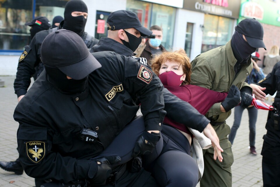 Police officers detain a woman during an opposition rally to protest the official presidential election results in Minsk, Belarus, Saturday, Sept. 19, 2020. Daily protests calling for the authoritarian president's resignation are now in their second month and opposition determination appears strong despite the detention of protest leaders. (AP Photo/TUT.by) Police officers detain a woman during an opposition rally to protest the official presidential election results in Minsk, Belarus, Saturday, Sept. 19, 2020. Daily protests calling for the authoritarian president's resignation are now in their second month and opposition determination appears strong despite the detention of protest leaders. (AP Photo/TUT.by)