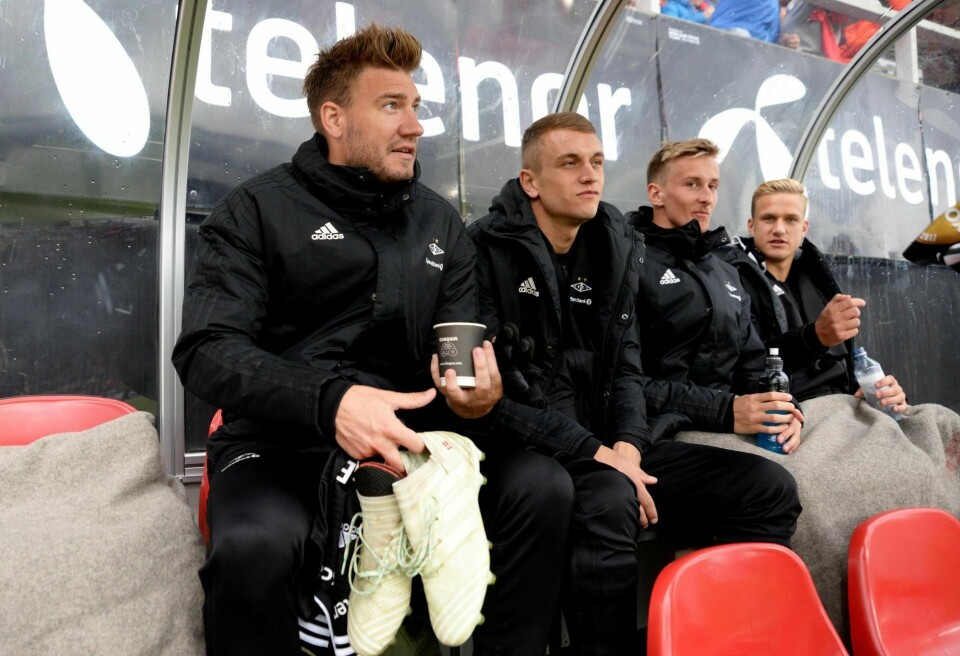 Nicklas Bendtner (t.v.) er anmeldt for vold.