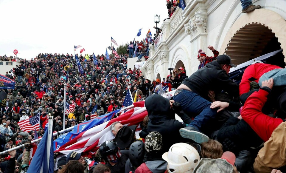Trump-tilhengere stormet Kongressen i Washington 6. januar. FILE PHOTO: Pro-Trump protesters storm into the U.S. Capitol during clashes with police, during a rally to contest the certification of the 2020 U.S. presidential election results by the U.S. Congress, in Washington, U.S, January 6, 2021. REUTERS/Shannon Stapleton/File Photo