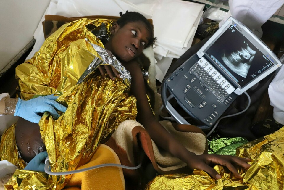 A pregnant migrant gets an ultrasound scan aboard a Spanish NGO Proactiva Open Arms rescue boat, after being in the Mediterranean sea, Wednesday, Nov. 11, 2020. The Open Arms rescue ship had been searching for the boat in distress for hours before finally finding it Wednesday morning in international waters north of Libya. The NGO had just finished distributing life vests and masks to the passengers to begin transferring them to safety when the flimsy boat split in half throwing them into cold waters. (AP Photo/Sergi Camara) A pregnant migrant gets an ultrasound scan aboard a Spanish NGO Proactiva Open Arms rescue boat, after being in the Mediterranean sea, Wednesday, Nov. 11, 2020. The Open Arms rescue ship had been searching for the boat in distress for hours before finally finding it Wednesday morning in international waters north of Libya. The NGO had just finished distributing life vests and masks to the passengers to begin transferring them to safety when the flimsy boat split in half throwing them into cold waters. (AP Photo/Sergi Camara)