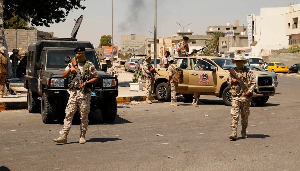 Libyske væpnede styrker i Tripolis gater etter kampene natt til fredag. Libyske væpnede styrker i Tripolis gater etter kampene natt til fredag. Foto: Yousef Murad / AP / NTB