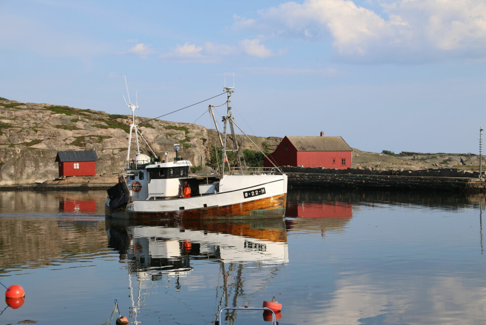 Fiskebåtene ved kaia preger miljøet i Utgårdskilen. Kystlandskap