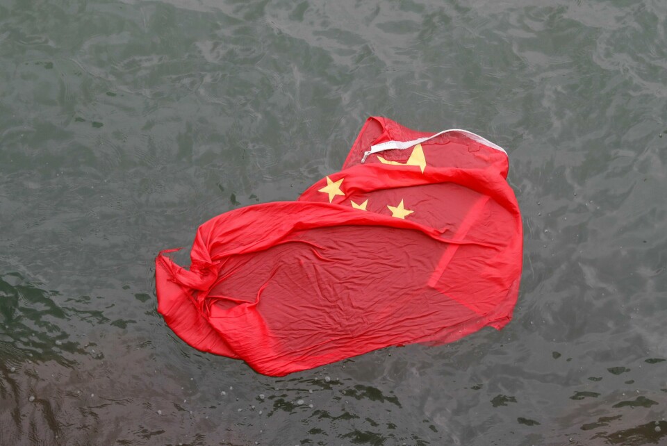 A Chinese flag floats on the surface it was thrown in the water by protesters during a demonstration in Hong Kong, Saturday, Aug. 3, 2019. Hong Kong protesters ignored police warnings and streamed past the designated endpoint for a rally Saturday in the latest of a series of demonstrations targeting the government of the semi-autonomous Chinese territory. (AP Photo/Vincent Thian) A Chinese flag floats on the surface it was thrown in the water by protesters during a demonstration in Hong Kong, Saturday, Aug. 3, 2019. Hong Kong protesters ignored police warnings and streamed past the designated endpoint for a rally Saturday in the latest of a series of demonstrations targeting the government of the semi-autonomous Chinese territory. (AP Photo/Vincent Thian)