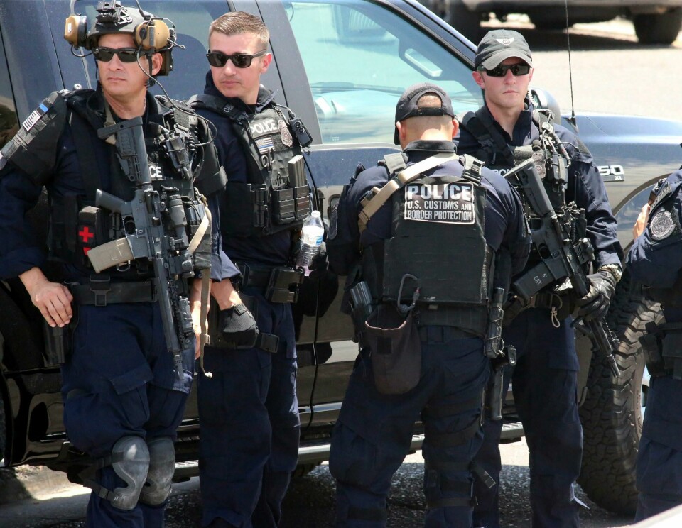 U.S. Customs and Border Protection officers gather near the scene of a shooting at a shopping mall in El Paso, Texas, on Saturday, Aug. 3, 2019. Multiple people were killed and one person was in custody after a shooter went on a rampage at a shopping mall, police in the Texas border town of El Paso said. (AP Photo/Rudy Gutierrez) U.S. Customs and Border Protection officers gather near the scene of a shooting at a shopping mall in El Paso, Texas, on Saturday, Aug. 3, 2019. Multiple people were killed and one person was in custody after a shooter went on a rampage at a shopping mall, police in the Texas border town of El Paso said. (AP Photo/Rudy Gutierrez)