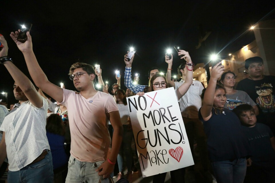 People gather in Juarez, Mexico, Saturday, Aug. 3, 2019, in a vigil for the 3 Mexican nationals who were killed in an El Paso shopping-complex shooting. Twenty people were killed and more than two dozen injured in a shooting Saturday in a busy shopping area in the Texas border town of El Paso, the stateÄôs governor said. (AP Photo/Christian Chavez) People gather in Juarez, Mexico, Saturday, Aug. 3, 2019, in a vigil for the 3 Mexican nationals who were killed in an El Paso shopping-complex shooting. Twenty people were killed and more than two dozen injured in a shooting Saturday in a busy shopping area in the Texas border town of El Paso, the stateÄôs governor said. (AP Photo/Christian Chavez)