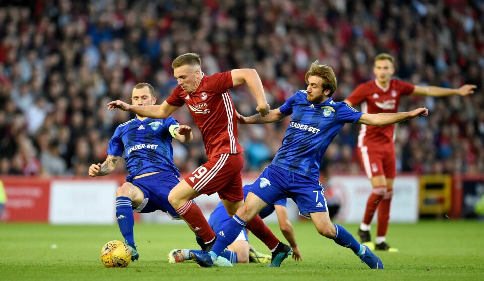 Lewis Ferguson (i rødt). Foto: Ian Rutherford/PA via AP NTB