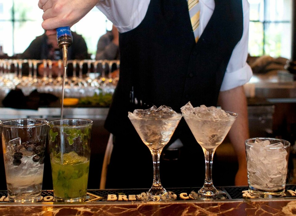 FILE - In this Monday, Nov. 19, 2012 file photo, a bartender prepares alcoholic drinks at a restaurant in San Francisco. Middle-aged men risk a faster mental decline as they age if they've been drinking heavily for years, new research suggests. The work was published Wednesday, Jan. 15, 2013 by the journal Neurology. (AP Photo/Eric Risberg)